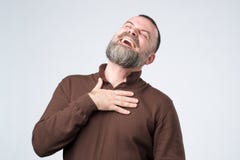 Portrait of a mature caucasian man with beard laughing stock photo Portrait of a mature caucasian man with beard laughing stock photo