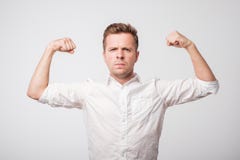 Portrait of a modern handsome man showing his power. royalty free stock photography Portrait of a modern handsome man showing his power. royalty free stock photography