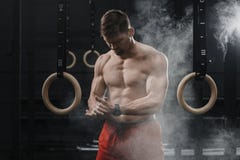 Portrait of muscular crossfit athlete clapping hands and preparing for workout at the gym stock photography Portrait of muscular crossfit athlete clapping hands and preparing for workout at the gym stock photography