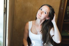 Portrait of a nice girl fixing her hair royalty free stock images Portrait of a nice girl fixing her hair royalty free stock images
