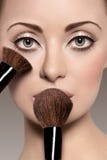 Portrait Of A Beautiful Woman With A Make Up Brush Royalty Free Stock Photography