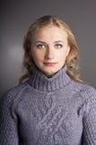 Portrait Of A Blonde In A Sweater. Studio Royalty Free Stock Photography
