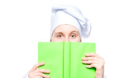 Portrait Of A Cook In A Cap Close-up, Face Covered With A Book Of Recipes Concept Photo Isolated On White Royalty Free Stock Photos Portrait Of A Cook In A Cap Close-up, Face Covered With A Book Of Recipes Concept Photo Isolated On White Royalty Free Stock Photos