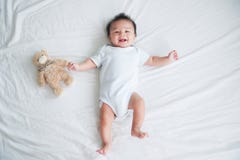 Portrait Of A Crawling Baby On The Bed In Her Room, Adorable Baby Boy In White Sunny Bedroom, Newborn Child Relaxing In Bed Royalty Free Stock Photography Portrait Of A Crawling Baby On The Bed In Her Room, Adorable Baby Boy In White Sunny Bedroom, Newborn Child Relaxing In Bed Royalty Free Stock Photography