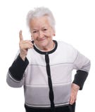 Portrait Of A Happy Old Woman Pointing Upwards Royalty Free Stock Image