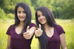 Portrait Of A Happy Sisters Twins Showing Thumbs Up Stock Photos Portrait Of A Happy Sisters Twins Showing Thumbs Up Stock Photos