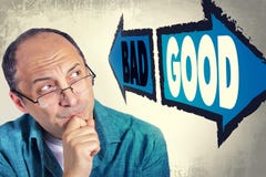 Portrait Of Adult Man Faced With Choice Between GOOD And BAD Stock Images Portrait Of Adult Man Faced With Choice Between GOOD And BAD Stock Images