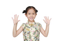 Portrait Of Asian Little Girl Wearing Cheongsam With Smiling And Shows Two Palms, Give Five Isolated Over White Background Royalty Free Stock Photography