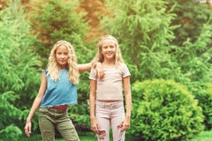 Portrait Of Beautiful Teenager Girls Twins At Park. Royalty Free Stock Photography Portrait Of Beautiful Teenager Girls Twins At Park. Royalty Free Stock Photography