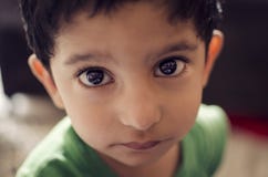 Portrait Of Cute Little Child Looking At Camera Stock Image