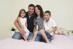Portrait Of Happy Caucasian Family With Two Kids Posing Together Royalty Free Stock Photography