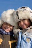 Portrait Of Little Girl And Boy In The Fur-cap Stock Photos