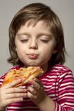 Portrait Of Little Girl Eating Pizza Stock Photos Portrait Of Little Girl Eating Pizza Stock Photos