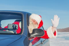 Portrait Of Santa Claus In The Car Stock Images