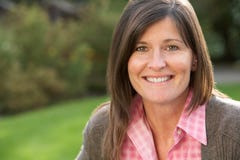 Portrait Of Smiling Brunette Woman Outdoors Stock Photos Portrait Of Smiling Brunette Woman Outdoors Stock Photos