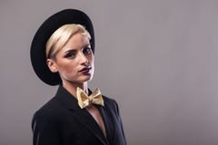 Portrait Of Woman Wearing A Suit And Hat Stock Image