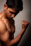 Portrait Of Young Indian Angry Man Over Dark Stock Images