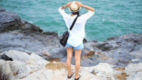 Portrait Of Young Woman Stand On The Rock With Sea, Blue Sky And Cloud At Koh Sichang In Thailand. Royalty Free Stock Photos Portrait Of Young Woman Stand On The Rock With Sea, Blue Sky And Cloud At Koh Sichang In Thailand. Royalty Free Stock Photos