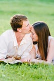 Portrait picture of a man kissing his girl`s forehead stock image Portrait picture of a man kissing his girl`s forehead stock image