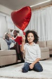Satisfied child playing with air ball at home Stock Photos Satisfied child playing with air ball at home Stock Photos