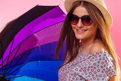 Portrait of a pretty woman with clororful umbrella wearing sunglasses royalty free stock photo Portrait of a pretty woman with clororful umbrella wearing sunglasses royalty free stock photo