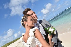 portrait recently married couple caribbean beach just looking towards skyline 64533105