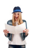 Shocked lady reading womens magazine Royalty Free Stock Photography Shocked lady reading womens magazine Royalty Free Stock Photography