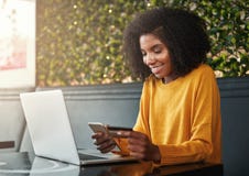 Young woman shopping online on mobile phone with credit card royalty free stock image Young woman shopping online on mobile phone with credit card royalty free stock image