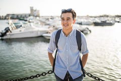 https://thumbs.dreamstime.com/t/portrait-smiling-asian-man-near-sea-boats-old-european-city-tourist-portrait-smiling-asian-man-near-sea-boats-96844841.jpg