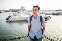 https://thumbs.dreamstime.com/t/portrait-smiling-asian-man-near-sea-boats-old-european-city-tourist-portrait-smiling-asian-man-near-sea-boats-96844852.jpg