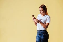 Portrait of smiling beautiful girl against of yellow background. royalty free stock images Portrait of smiling beautiful girl against of yellow background. royalty free stock images