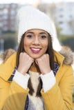 Portrait of smiling beautiful latin woman with winter clothing. royalty free stock photos Portrait of smiling beautiful latin woman with winter clothing. royalty free stock photos