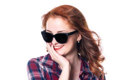 Portrait of a smiling beautiful young red-haired girl in sunglasses looking away royalty free stock image Portrait of a smiling beautiful young red-haired girl in sunglasses looking away royalty free stock image
