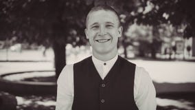 Portrait of a smiling groom in a black vest stock image Portrait of a smiling groom in a black vest stock image