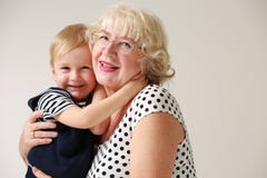 Portrait of a smiling and happy grandmother and her grandson Stock Photography Portrait of a smiling and happy grandmother and her grandson Stock Photography