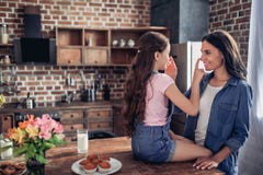 Mother and daughter touching noses with fingers royalty free stock images Mother and daughter touching noses with fingers royalty free stock images