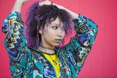 Portrait of a teen woman with purple afro hair and blue lips on stock image Portrait of a teen woman with purple afro hair and blue lips on stock image
