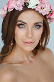 Portrait of a tender beautiful girl in a pink dress and a wreath royalty free stock photography Portrait of a tender beautiful girl in a pink dress and a wreath royalty free stock photography