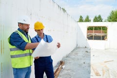 Construction Worker Discussing Floor Plans with Supervisor stock photography Construction Worker Discussing Floor Plans with Supervisor stock photography