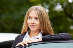 Portrait of woman leaning on car door stock images Portrait of woman leaning on car door stock images