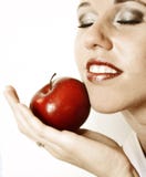 Beautiful woman with red apple on the white background royalty free stock photography Beautiful woman with red apple on the white background royalty free stock photography