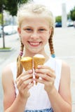 Portrait of 7 years old kid girl eating tasty ice cream in city Royalty Free Stock Photography Portrait of 7 years old kid girl eating tasty ice cream in city Royalty Free Stock Photography