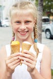 Portrait of 7 years old kid girl eating tasty ice cream in city Stock Photography Portrait of 7 years old kid girl eating tasty ice cream in city Stock Photography
