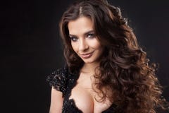 Portrait of a young attractive woman with gorgeous curly hair. Attractive brunette royalty free stock images Portrait of a young attractive woman with gorgeous curly hair. Attractive brunette royalty free stock images