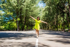 https://thumbs.dreamstime.com/t/portrait-young-beautiful-asian-girl-walking-line-middle-road-hulhumale-maldives-63939809.jpg