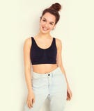 Girl with no makeup in summer hipster clothes posing near wall Royalty Free Stock Image Girl with no makeup in summer hipster clothes posing near wall Royalty Free Stock Image