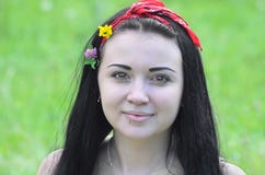 Portrait of a young, beautiful girl, brunette with flowers in her hair and scarf stock photography Portrait of a young, beautiful girl, brunette with flowers in her hair and scarf stock photography