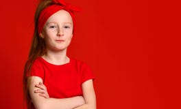 Young gentle redhead teenage girl with healthy freckled skin, wearing a red tank top, looking at the camera stock photo Young gentle redhead teenage girl with healthy freckled skin, wearing a red tank top, looking at the camera stock photo