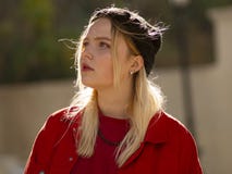 Portrait of a young girl blonde teenager in a knitted black hat on the street royalty free stock images Portrait of a young girl blonde teenager in a knitted black hat on the street royalty free stock images