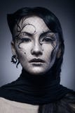 Portrait of young gothic woman isolated on dark stock photos Portrait of young gothic woman isolated on dark stock photos